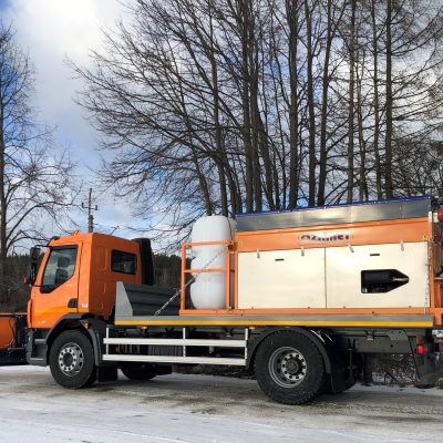 Removing hard pack snow from roads with Ozamet snow plough