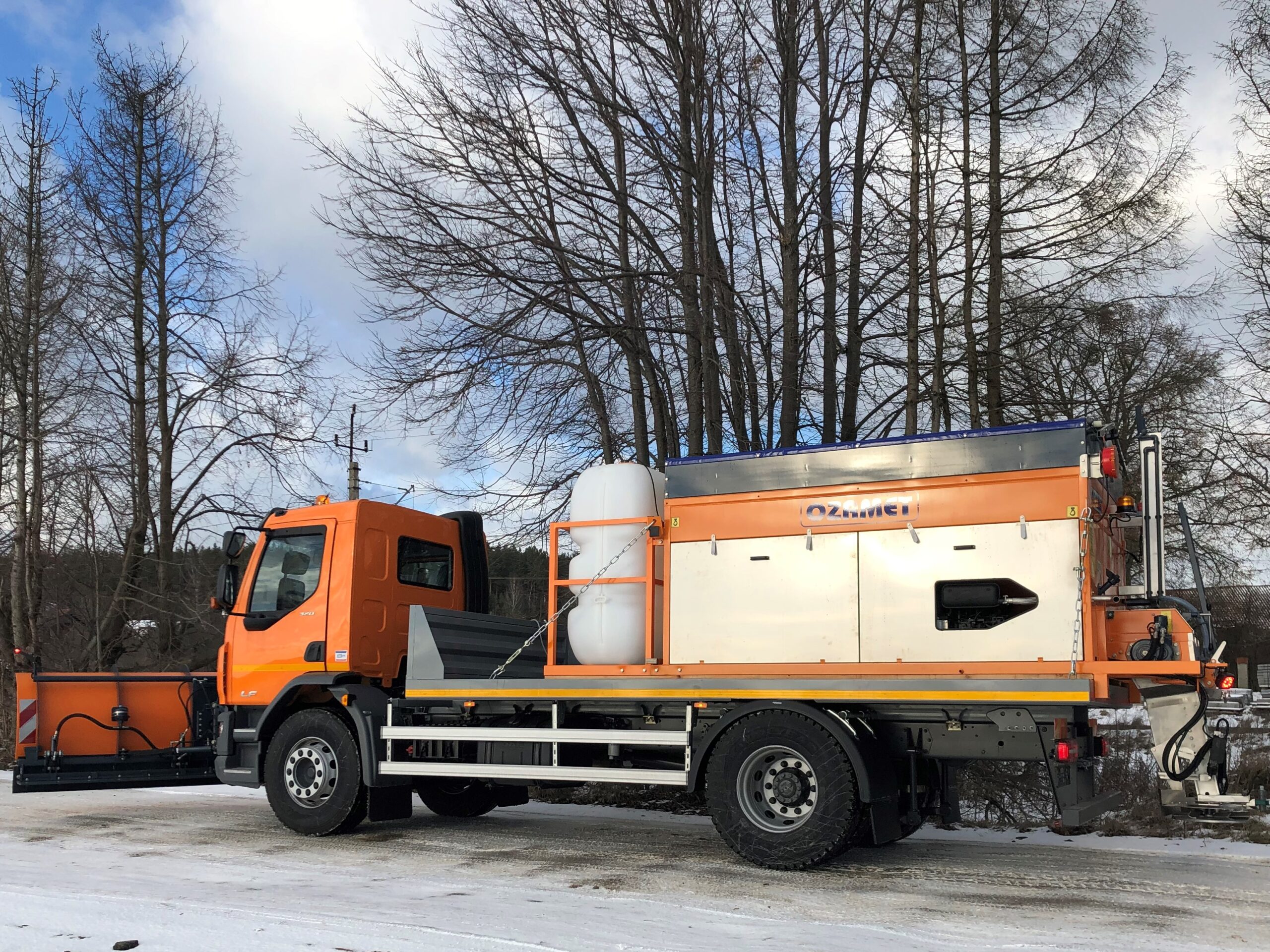 Removing hard pack snow from roads with Ozamet snow plough